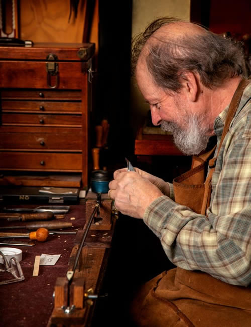 Stephen Bacon of Bellwood Violin rehairing a violin bow