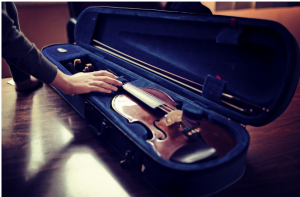 photo of violin and bow in a case
